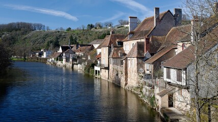 Fototapeta na wymiar A view of the houses of an medieval french village, aligned along a river