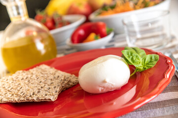 Nutritious dishes prepared with mozzarella salad and tomatoes. Natural and healthy ingredients of the Mediterranean diet: olive oil, cereals, peppers, vegetables, fruit and cheese. Farmers products