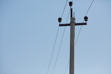 Obraz premium Pole with power wires. Pole and wires.