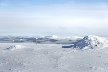 view of a mountain above the clouds during holiday in the sun