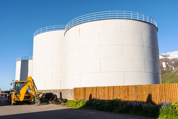 Huge fuel tanks in a business park in Iceland on a clear summer day