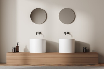 Beige and wooden bathroom interior with two sinks and mirrors