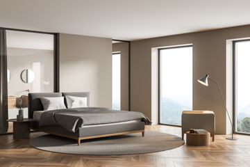Modern cozy bedroom interior with large comfortable grey bed