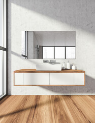 Bathroom interior with sink and mirror on grey wall near window