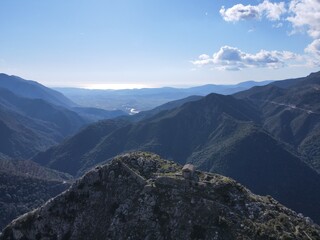 Fototapeta premium Aerial view Of historical kougi mountains and agia paraskevi church of souli In epirus, greece