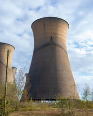 Fototapeta premium Willington, Derby, UK, April,11,2021:The Imposing Architectural Structure of the Disused Cooling Towers at Willington Derbyshire.