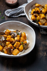 homemade pumpkin gnocchi with mushroom sauce and ricotta