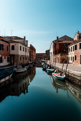 Fototapeta na wymiar VENICE, IT - MARCH 07 2021: narrow canal in Venice