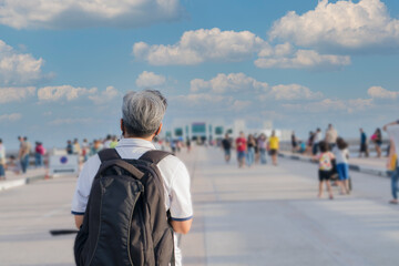 Travel outdoor trip on vacation lifestyle concept. Behind Traveler of Smart Asian Woman backpack...