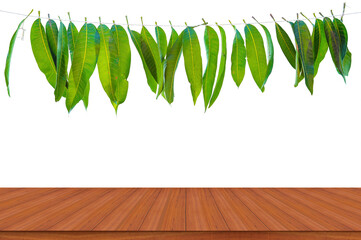 Mango leaf garland with wooden table background. holiday ornate decoration.