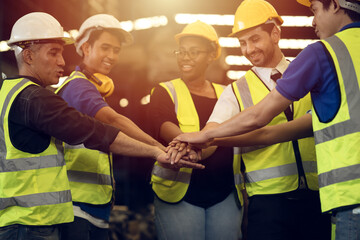 Engineer Teamwork Concept,Worker team join hands together in factory. People joining for...