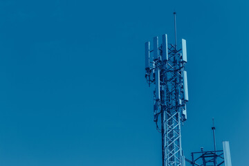 Mobile phone Signal tower cell site of Digital 4G Antenna blue color tone for high technology...