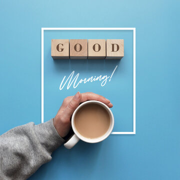 The phrase "Good morning" and a cup of coffee on a blue background. Good morning wishes
