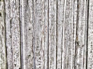 gray wooden planks deformation of the old fence