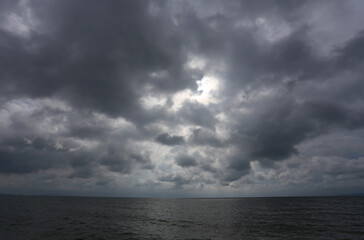 Dark sky background, the sea in the storm.