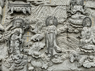 Fototapeta na wymiar Carvings on a wall of Linguang monastery at Badachu near Beijing, China