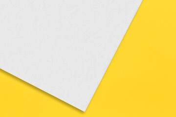 Gray paper is placed on top of the yellow paper.