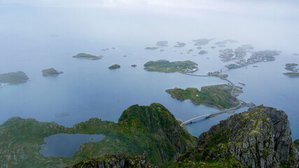On top of the Festvågtind, looking towards a misty Henningsvær. One of the most beautiful city...