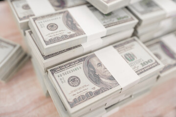Fototapeta premium American Dollars Cash Money. One Hundred Dollar Banknotes. Stack of one hundred dollar bills .shallow focus effect.