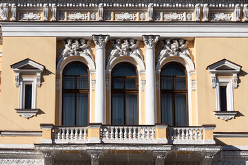Fototapeta premium Windows on old city facades, with decorative elements