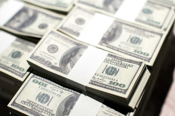 American Dollars Cash Money. One Hundred Dollar Banknotes. Stack of one hundred dollar bills .shallow focus effect.