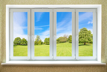 View through a modern PVC window onto beautiful spring landscape
