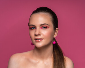 High beauty photo of a lovely young girl with wonderful professional makeup