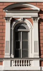 Windows on old city facades, with decorative elements