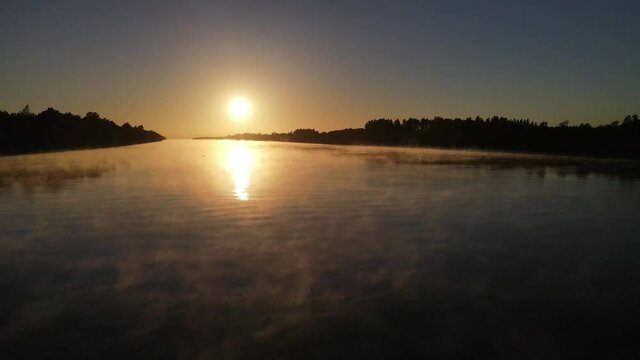 Aerial shot foggy Amazon river in South America at sunset
