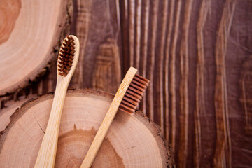 Obraz na płótnie Canvas Eco-friendly bamboo teethbrushes on the wooden board. Zero waste