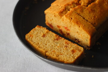 Slices of tutti frutti cake loaf made with whole wheat flour.