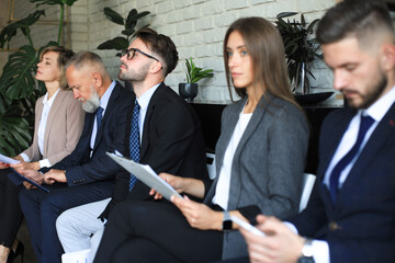 Modern business people waiting for job interview.