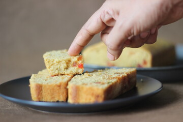 Slices of tutti frutti cake loaf made with whole wheat flour.