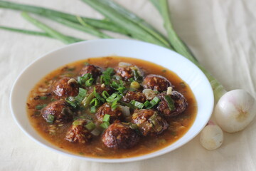 Veg Manchurian. A tasty Indo Chinese dish with fried vegetables balls in a spicy, sweet and tangy sauce. The vegetable ball is made of cabbage, carrot and capsicum