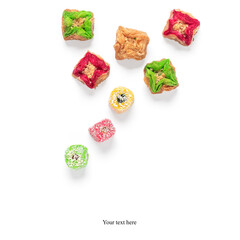 Middle eastern dessert baklava and Turkish delight isolated on white background.. Ramadan. Arabian sweets. Creative layout. Top view.