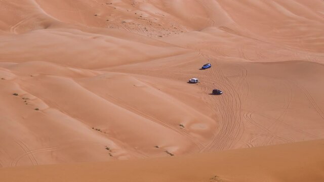Dune Bashing - Vehicles Off-Roading On Remote Sand Dunes At Fossil Rock In Sharjah Near Dubai, United Arab Emirates. - High Angle Shot