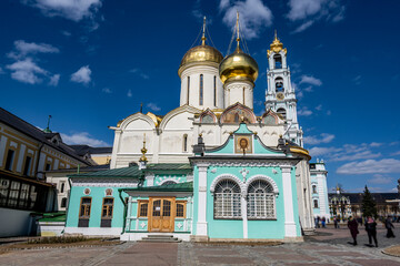 golden towers and ancient architectural solutions of the Trinity-Sergievskaya Lavra in Sergiev Posad on a sunny spring day 