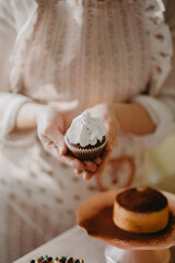 confectioner makes sweet delicious cakes at home. in bright colors