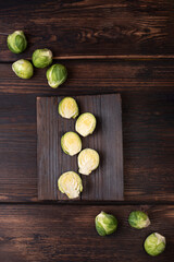 Fototapeta na wymiar Brussels sprouts on dark wooden background, rustic style, healthy food.