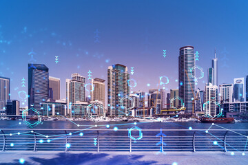 Skyscrapers of Dubai business downtown. International hub of trading and financial services. Technology theme icons hologram, concept of big data. Double exposure. Dubai Canal waterfront.