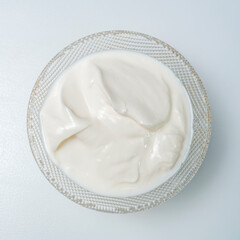 Top view sour cream against white background. Closeup.