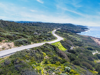 Fototapeta na wymiar Aerial view of a coastal road in Sardinia