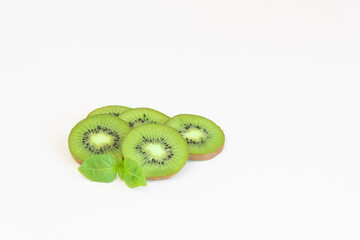 Close up fresh kiwi slices with leaf isolated on white background