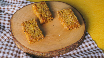 Selected Focus Tempe or Tempeh made of fermentation process that binds soybeans into a cake form, sliced and fried. Famous in Indonesia and Malaysia. isolated in white