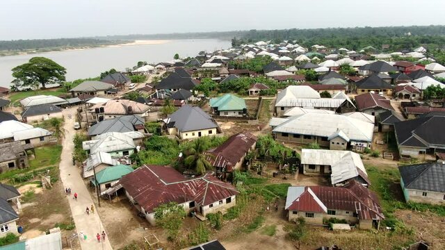 The township of Odi in the Bayelsa State of Nigera - aerial view of the community and Nun River