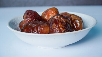 Selective Focus - sweet dried date palm fruits or kurma, ramadan (ramazan) food