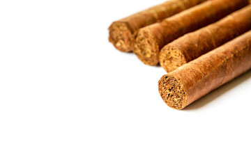 Group of brown cuban cigars isolated on white