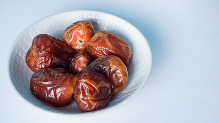 Selective Focus - sweet dried date palm fruits or kurma, ramadan (ramazan) food