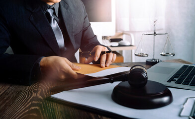 Business and lawyers discussing contract papers with brass scale on desk in office. Law, legal services, advice, justice and law concept picture with film grain effect
