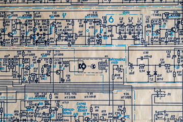 Old radio circuit printed on vintage paper electricity diagram as background. Electric radio scheme...